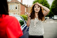 Women looking distraught after a car accident