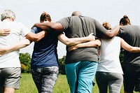 Group of people hugging in the park