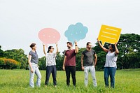 Happy diverse people holding colorful speech bubbles