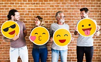 Happy people holding positive emoticons