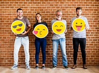 Happy people holding positive emoticons