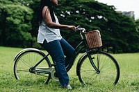 Young woman on her bicycle in a park