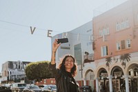 Cheerful woman taking a selfie