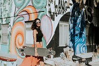 Beautiful woman holding a longboard