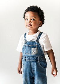 Cute little boy in dungarees