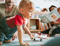 Little boy playing in a classroom