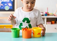 Environmental boy playing toys in a playroom
