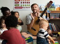 Nursery children playing with musical instruments in the classroom