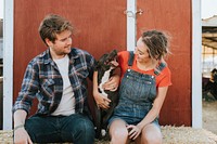 Couple with a rescued pit bull terrier dog