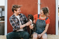 Couple with a rescued pit bull terrier dog