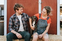 Couple with a rescued pit bull terrier dog