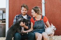 Happy couple living with their rescued dogs