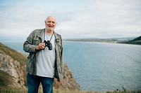 Happy senior man with a pair of binoculars