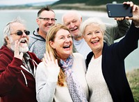 Group of happy seniors taking a selfie