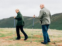 Happy seniors with trekking poles