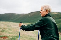 Senior woman with trekking poles
