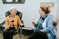 Happy people enjoying a glass of wine