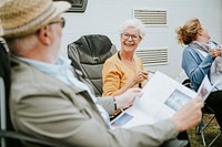 Senior people reading the newspaper