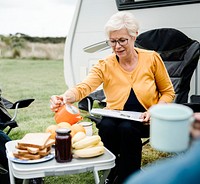 Elderly woman pouring a cup of coffee