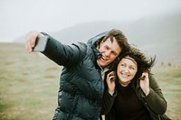 Happy couple taking a selfie