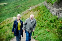 Happy romantic seniors strolling together