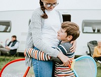 Brother and sister embracing each other after a match