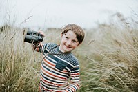 Happy young boy with a pair of binoculars