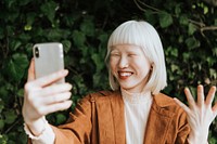 Albino woman having a video call