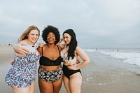 Beautiful confident women taking a selfie at the beach