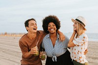 Friends dancing and having fun at the beach