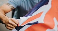 Man showing his fist with UK flag during a protest