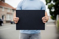 Person showing a blank board to support a movement