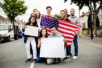 Group of activists showing American flag and blank posters