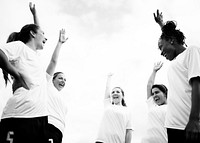 Female football players cheering on the field