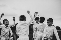 Young cricket players cheering to their victory