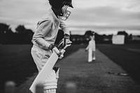 Cricketer on the field in action