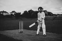 Cricketer on the field ready to swing