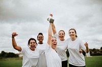 Cheerful female football players celebrating their victory