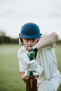 Cricketer on the field in batting position
