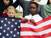 Group of diverse kids showing a US flag in a protest