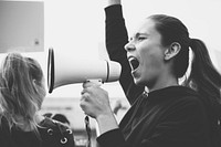 Female activist shouting on a megaphone