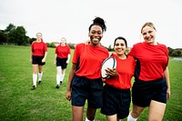 Energetic female rugby players walking together