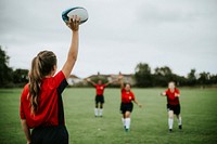 Female rugby player ready to throw the ball