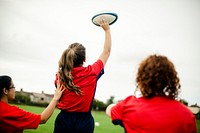 Female rugby player throwing a ball
