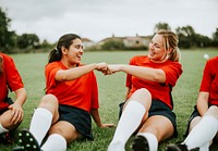 Cheerful rugby players doing a fist bump