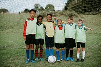 Junior football team standing together