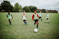 Junior football team playing on the field