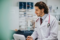 Doctor checking a patients blood pressure