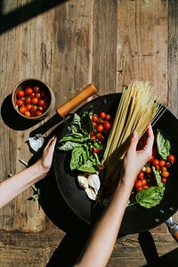 Fresh organic vegetables and ingredients prepared in a pan