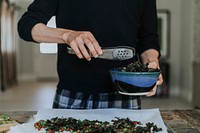 Man making fried kale and chickpeas for dinner